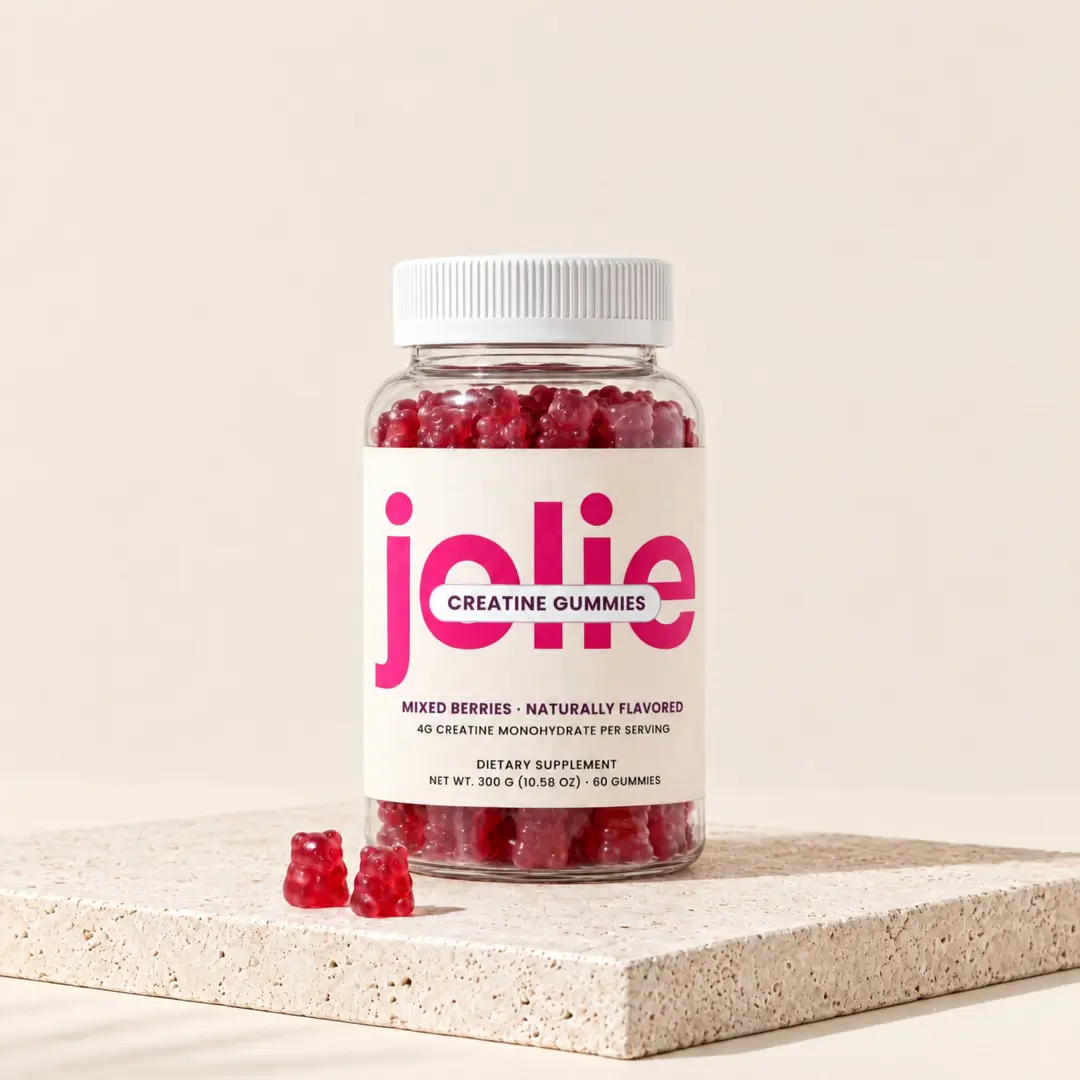 A jar of jolie Creatine gummies: the cap lifts off and gummy bears float up out of the jar.