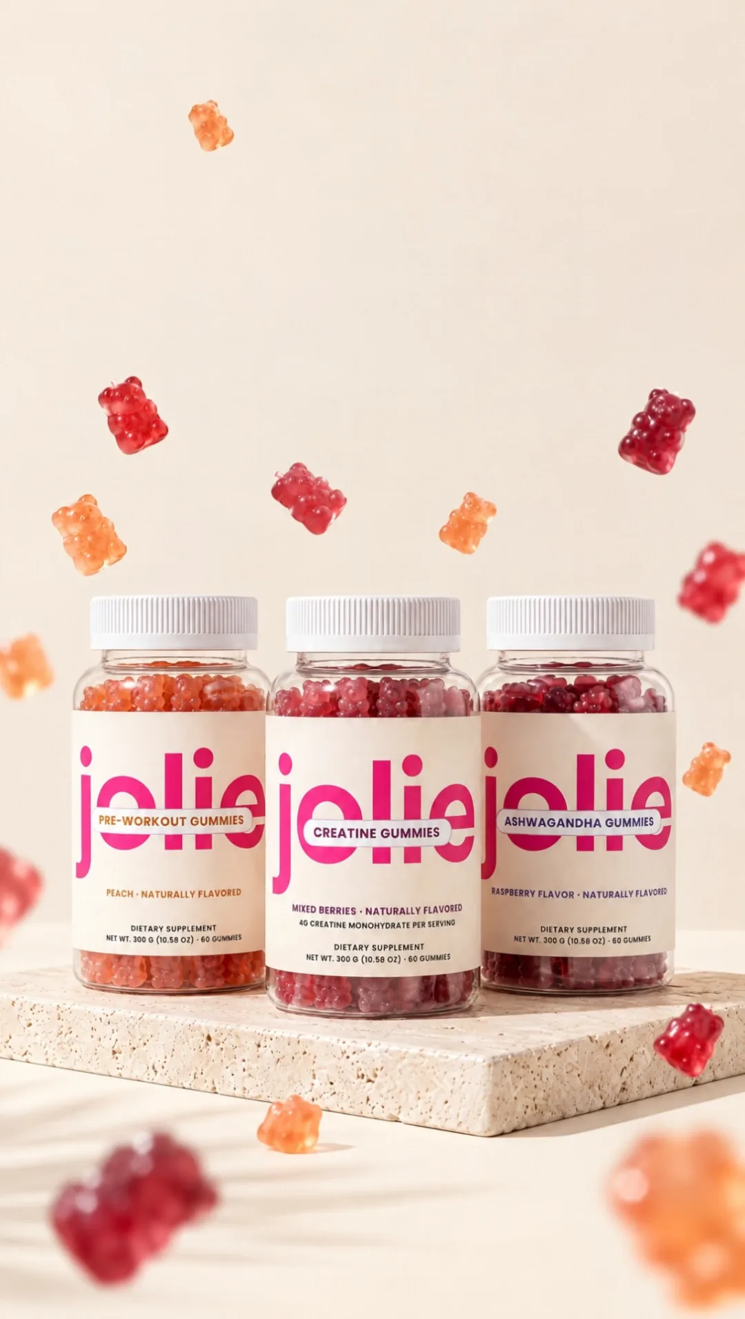 The four jolie jars on a travertine stone with gummy bears floating around them